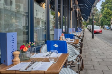 a restaurant with a table and chairs outside