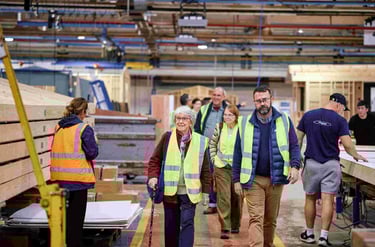 Jean Morris walking through the Willerby factory