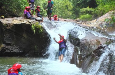 Sliding down a water fall wearing PPE is thrilling and fun
