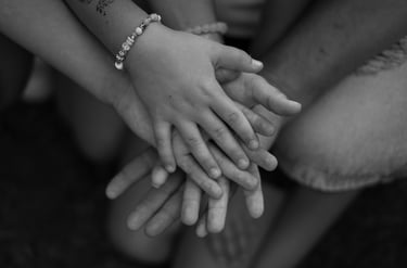 Black and white image with hands holding each other 
