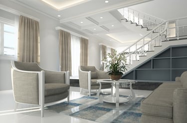 Elegantly designed living room with a predominantly white color scheme, accented by gray furniture a