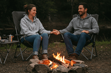 Kelty Camping Chair, couple sitting around a campfire sitting in a comfortable camping chair