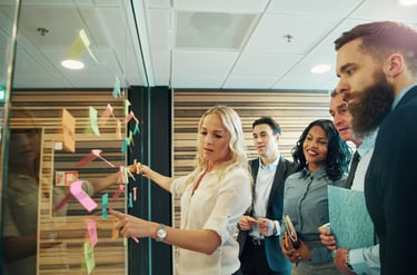 A team brainstorming with sticky notes during an innovation workshop.