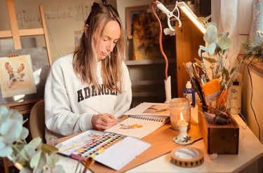 Alex Goddard working on a new painting in her home studio 