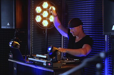 a man in a black shirt and a laptop