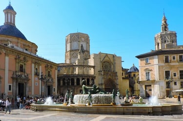 "Historic Plaza de la Virgen featuring Valencia's majestic Basilica and Cathedral, 