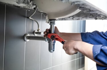 plumber fixing drain