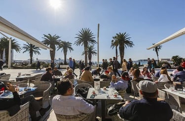 People drinking coffee on the Riva promenade in Split, Croatia