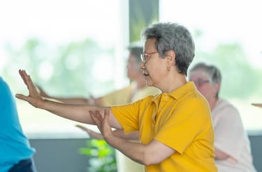 Practicing Tai Chi movements which helps promote wellness and healthy aging