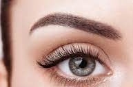 a woman with a beautiful eyeliners and a pair of lashes