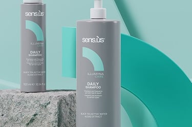 two bottles of hair care products on a table