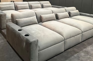 Velvet theater seating with cup holders and tiered rows by Solo Home Decor for home cinema.