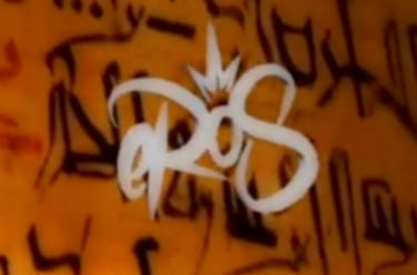 a close up of a sign on a wall eros