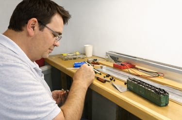 Person detailing model at Arizona Model Railroad Club