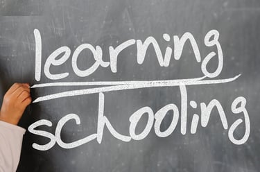 a person writing on a chalkboard with a chalkboard