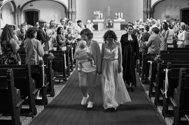 Newlywed couple walking away from the altar after the church ceremony.