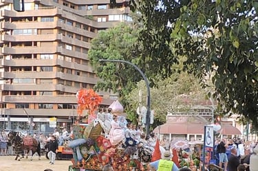 Battle of Flowers, float adorned with flowers, and women in fallera dresses