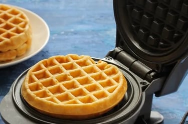 a waffler on a plate with two waffles on it