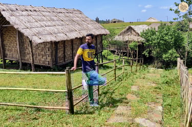 Khasi Heritage Village, Meghalaya - walking past traditional huts.