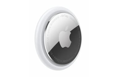 a round mirror with a white apple logo
