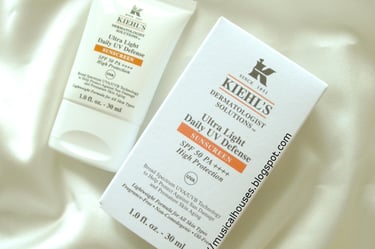 a bottle of Kiehl's skin care products