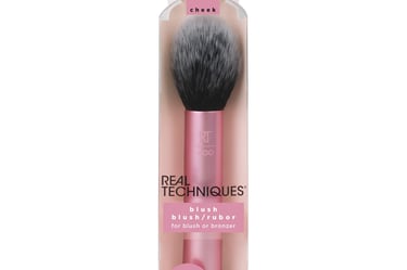 a pink makeup brush with a brush and a brush