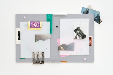 Karl Russell Vickers a notice board with fragments of pictures, paper cutouts and leftover tape