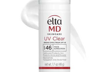 a white bottle of liquid with a white background