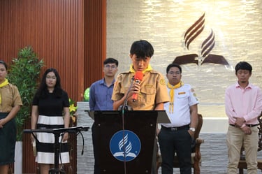 Elementary scout student speaking on a podium