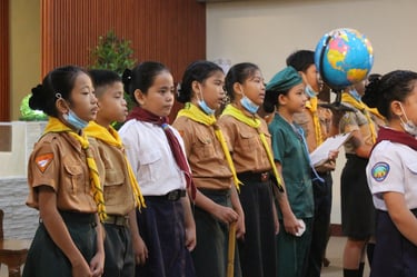 Group of elementary scout students standing in line