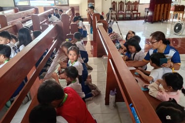 A lot of Elementary students drawing on wooden church benches