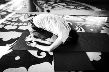 A yoga practitioner executes the Child Pose