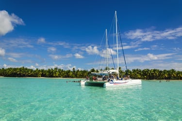 Catamaran tour in clear turquoise water at Saona Island, Dominican Republic