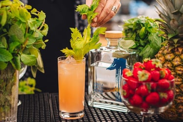 tequila cocktail fruity on a bar with a bottle of uno tequila blanco - premium tequila blanco
