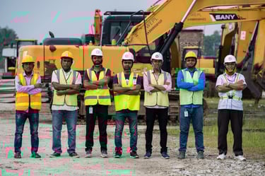 a group of men standing in front of a construction site