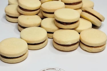 a bunch of cookies and a cupcake on a table