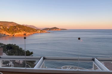 a balcony with a view of the ocean