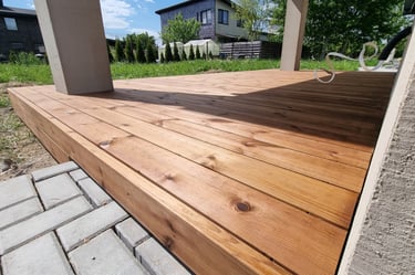 a wooden deck with a bench and a skateboard
