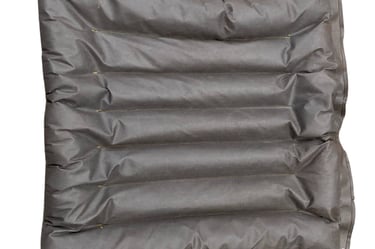 absorbent mat of grey porous geotextile with ridges. used for environment protection against oil spills chemical spills