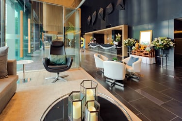 Hotel lobby with art and lounge seating — Disney adventures and late-night mischief
