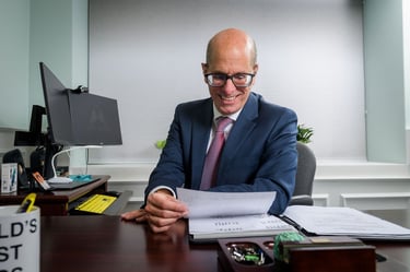 David D'Arcangelo Working at his desk