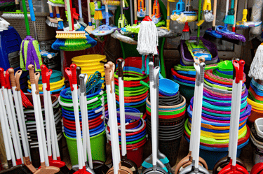 a bunch of different colored plastic brooms and brooms