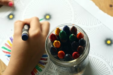 Child's hand with crayons