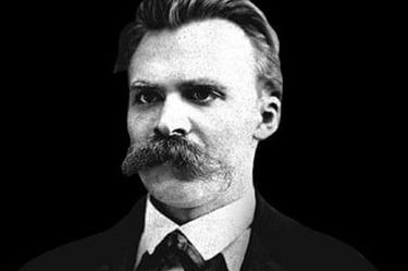 A black and white potrait of German writer Neitzsche with his glories moustache. 