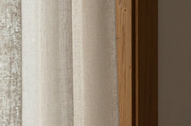 Macro detail shot of a textured linen curtain meeting a solid oak window frame, soft natural light, high tactile contrast, calm minimal atmosphere.