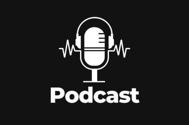 display of white microphone and the word podcast on a black background 