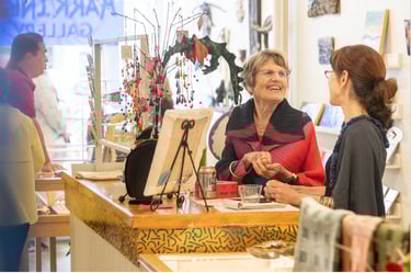 artist associates chattinbg in the gallery