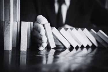 a man in a suit and tie is playing domino board game