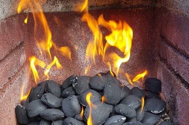 A charcoal bbq and lots of fire