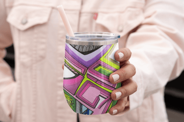 a person holding a cup of coffee and a drink